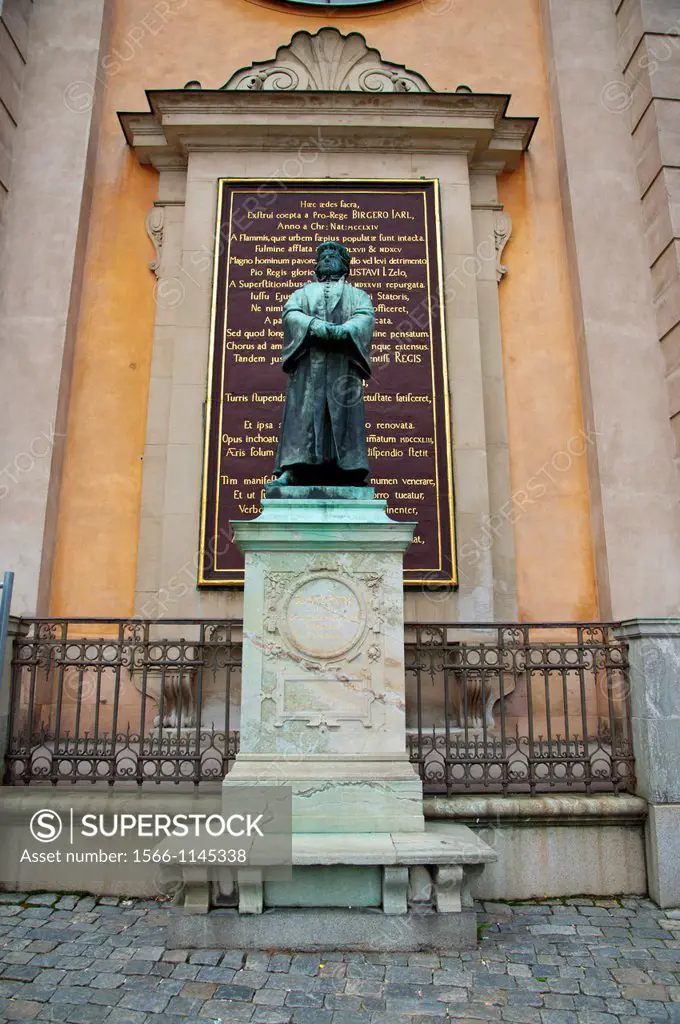 Statue of the 16th century Protestant reformist Olaus Petri 1897 by Theodor Lundberg at Slottsbacken square Gamla Stan the old town Stockholm Sweden E...