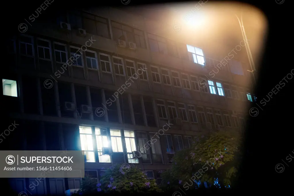 Night view of the facade of an apartment building in the city of Tel Aviv, Israel