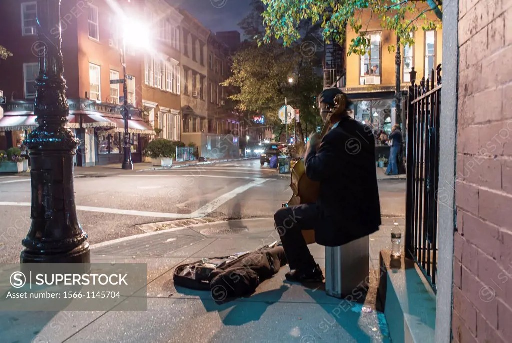 New York City, NY, USA, Street Scenes, Man Playing Cello at Night, Charles Street Corner, in Greenwich Village