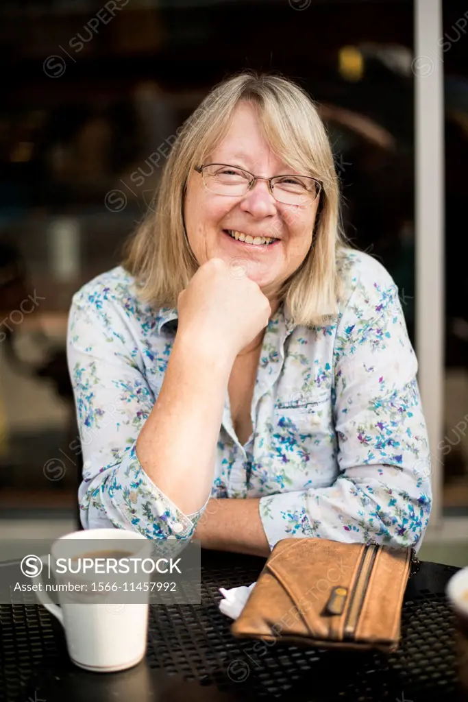 Woman, 60, at a coffee shop.