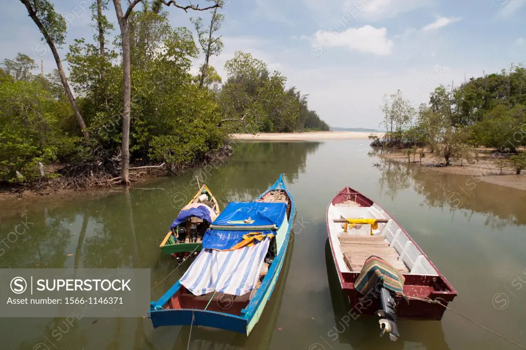 Small fishing boats at berthed along the river bank of Camp Pueh, Sarawak, Malaysia.