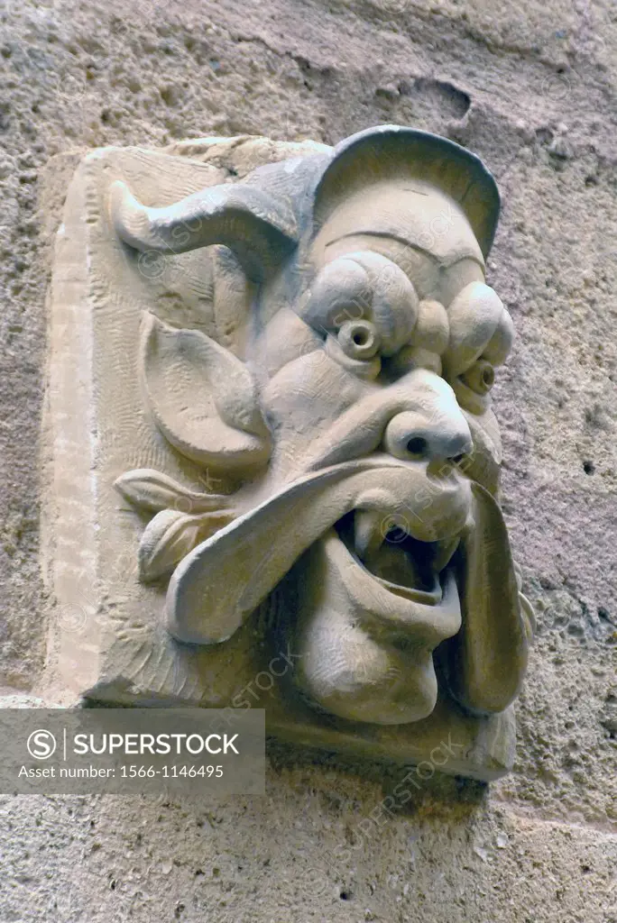Since Roman times, a scary looking face-in tthis case a charicature of a neighbor-placed over a door have protected the house´s inhabitants from dange...