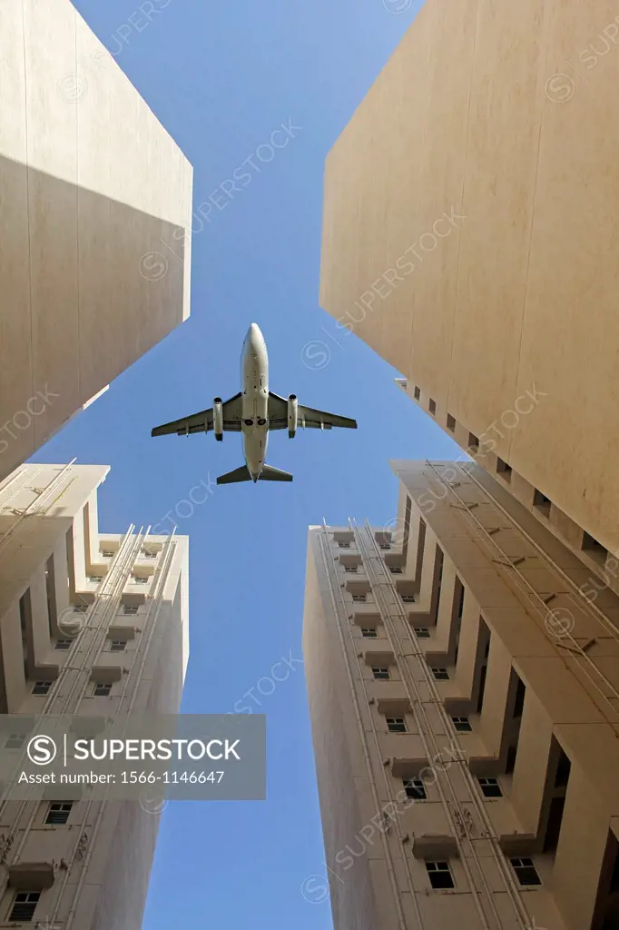 Airplane flying over a Building, Pune, Maharashtra, India