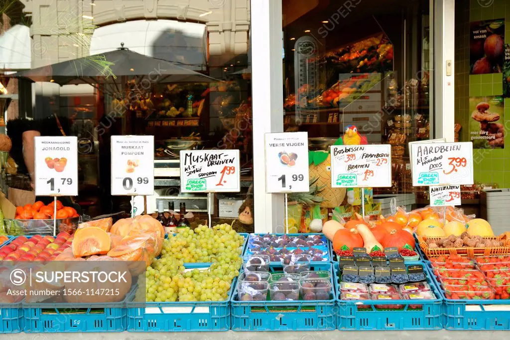 Productsfruits and vegetables displayed in front of green grocer on the Stationstraat in Maastricht, the Netherlands