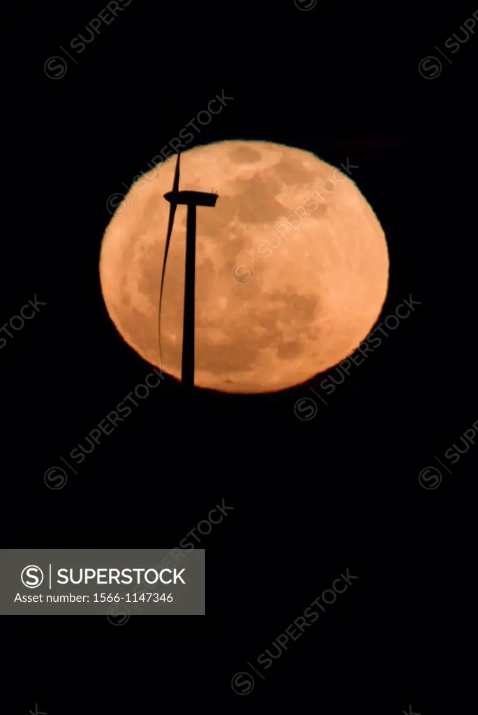 Turbine backlit with the full moon