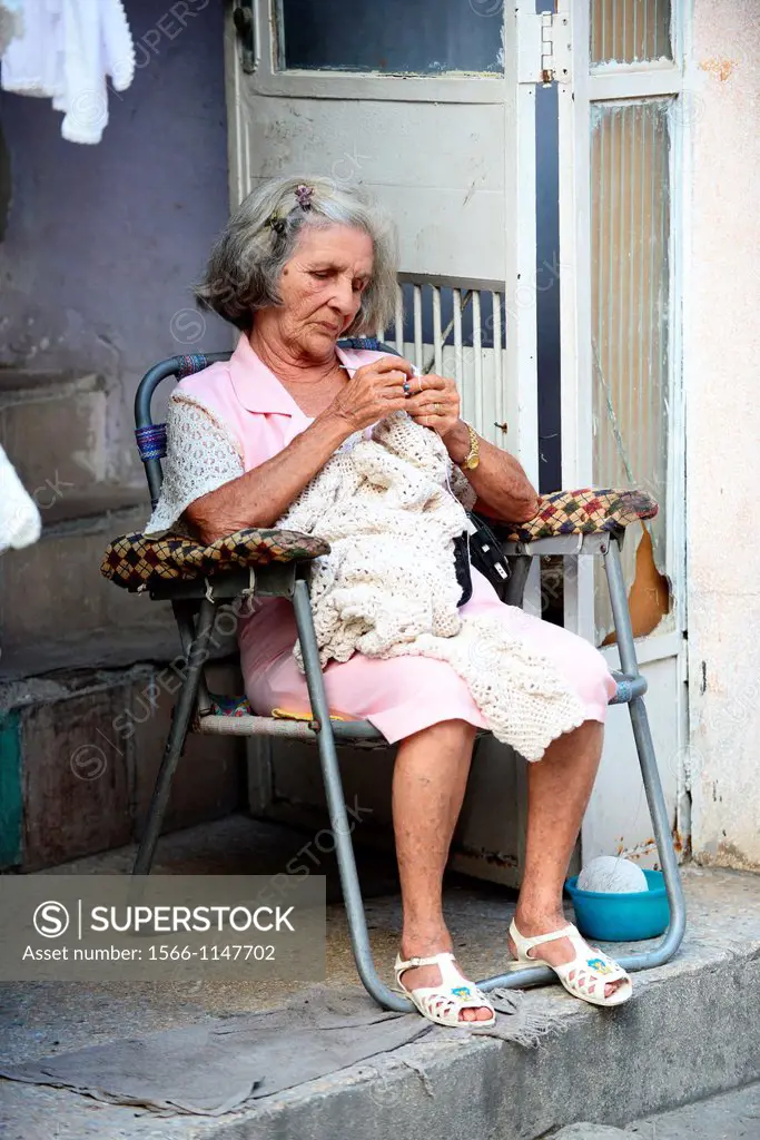 Old woman needlepointing a dress in La Havana ,Cuba