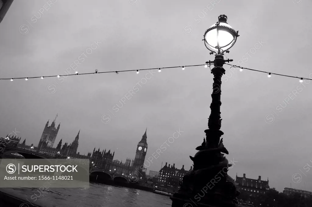 England Lamposts Over River Thames At Night with Big Ben and Houses Of Parliament in Background, London, United Kingdom