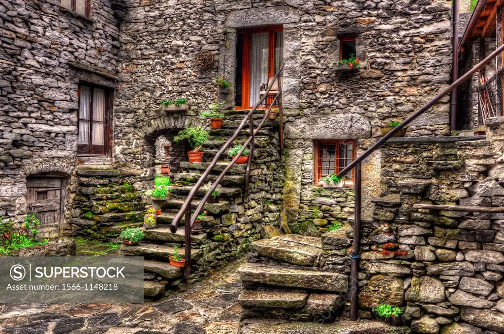Rustic house in stone with stairs