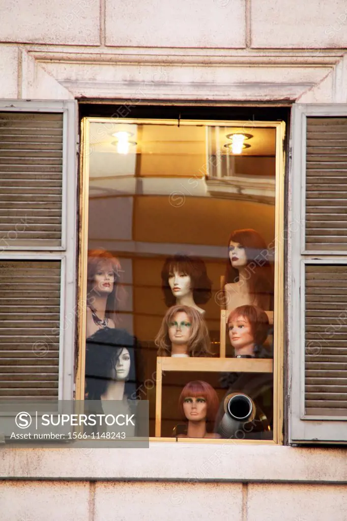 female wig shop window in rome italy