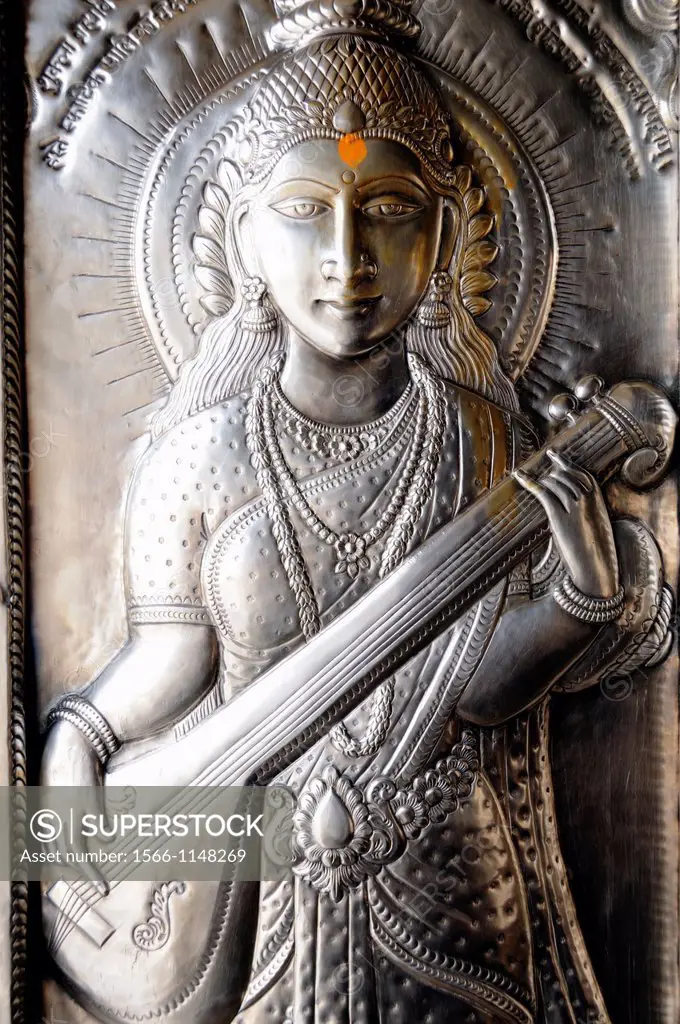 India. Punjab. Amritsar. Durgiana Temple Durga or Lakshmi Narayan. Silver doors, details of Saraswati the goddess of wisdom and the arts.