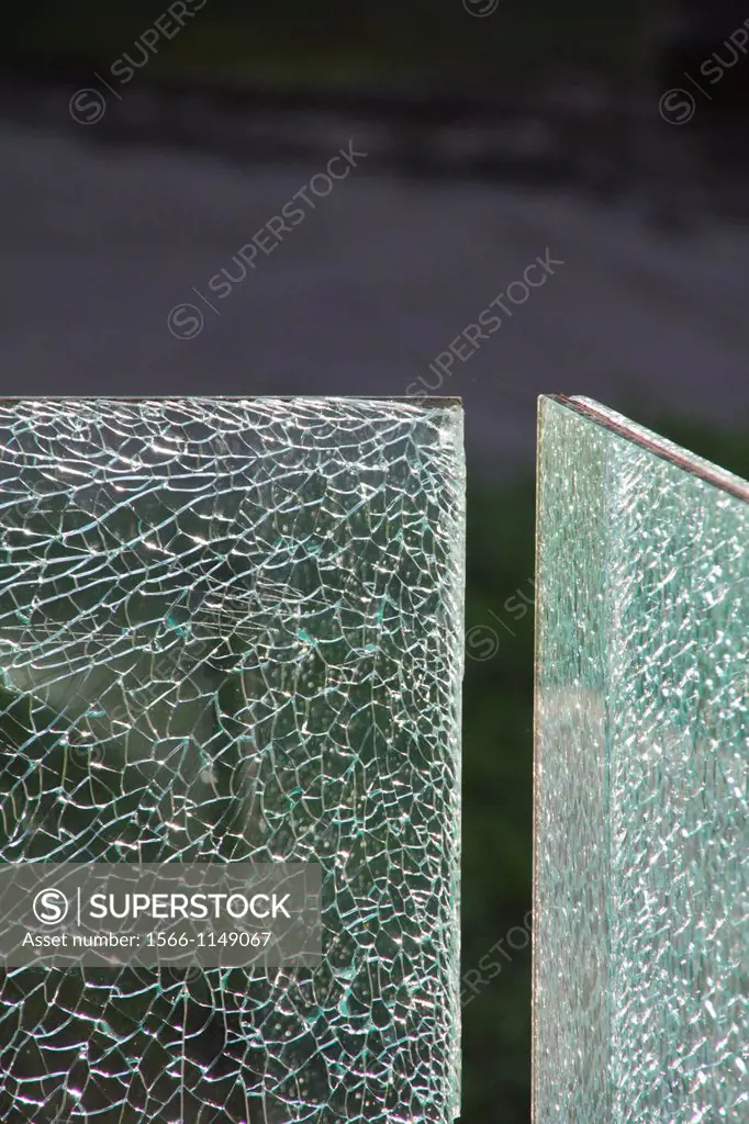 detail of broken glass window pane outdoors