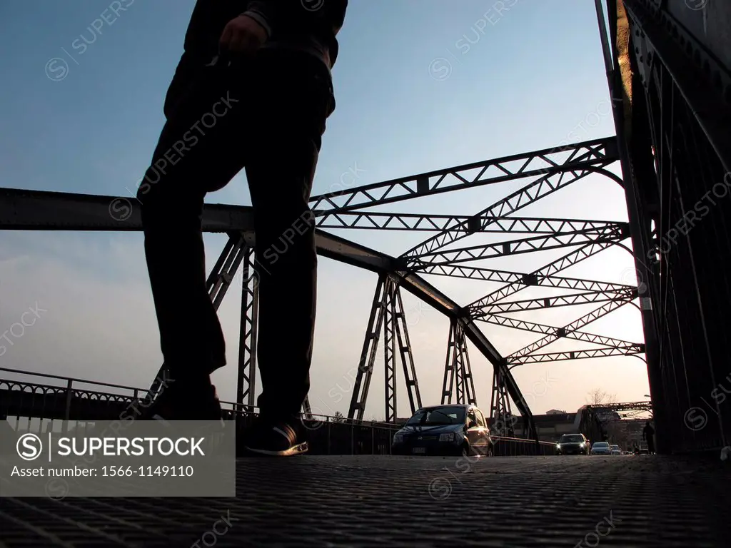 people walking on iron ponte dell´industria bridge in rome italy