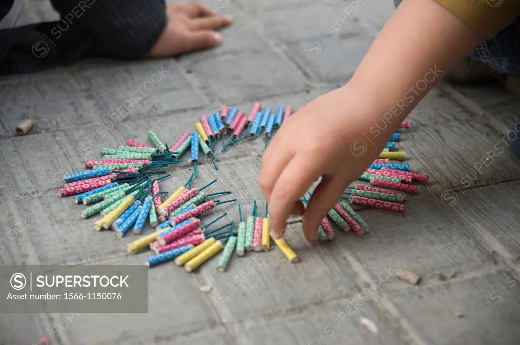 CHILDREN playing with firecrackers