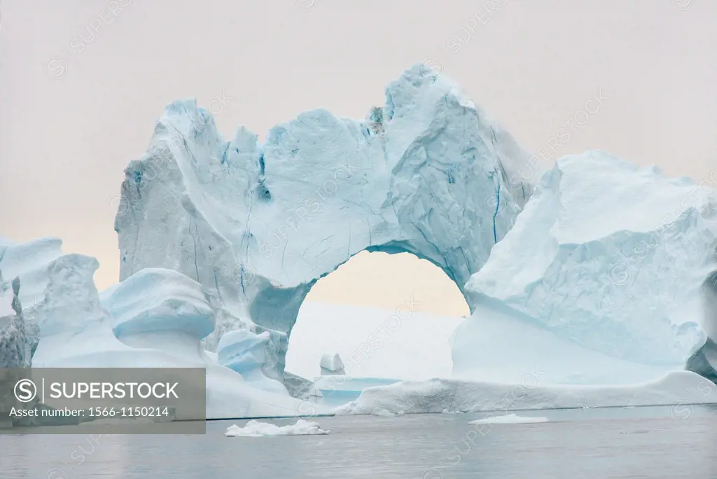 Greenland, Melville Bay, Cape York, Arch shaped iceberg