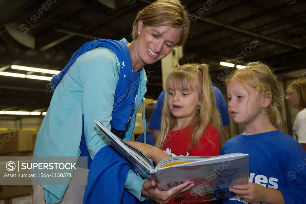 Romulus, Michigan - Children look over books being distributed by the nonprofit organization First Book in cooperation with the American Federation of...