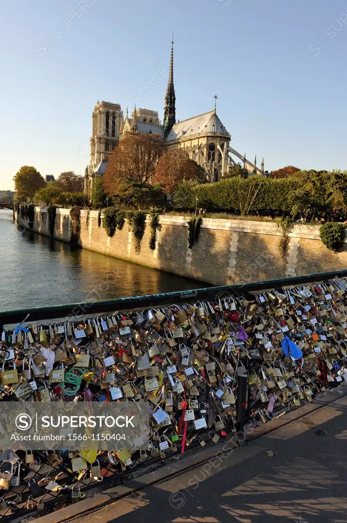 love padlocks on Pont de l´Archeveche with the Notre Dame Cathedral background, Ile de la Cite, Paris, Ile-de-France region, France, Europe