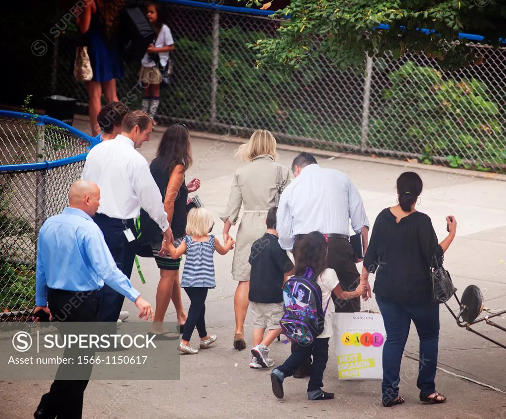 Parents and children arrive at the Chelsea School in the New York neighborhood of Chelsea for the first day of class New York City has the largest pub...