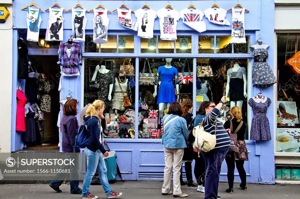 Group of tourists in a street market, Portobello Road Market, London, England, UK
