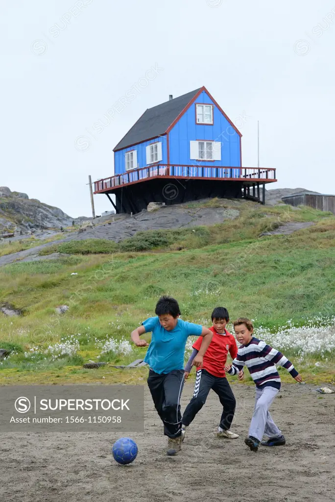 Greenland, Baffin Bay, Tasiusaq, Inuit children playing fooball