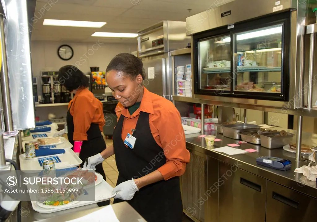 West Bloomfield, Michigan - Crystal Boykin right and Sandy Schwarze prepare lunch trays for hospital patients in the kitchen of Henry Ford West Bloomf...