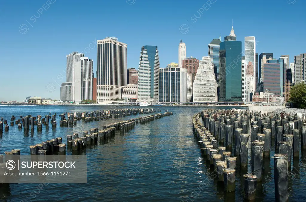 Wood Pilings Pier One Brooklyn East River To Manhattan Skyline New York City USA