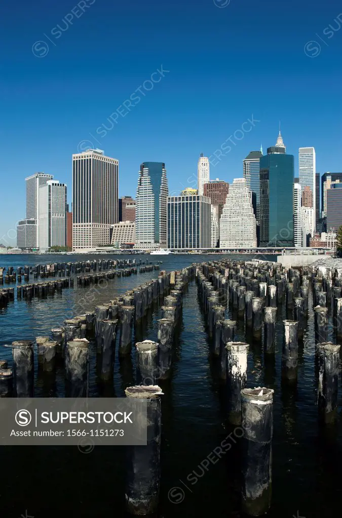 Wood Pilings Pier One Brooklyn East River To Manhattan Skyline New York City USA