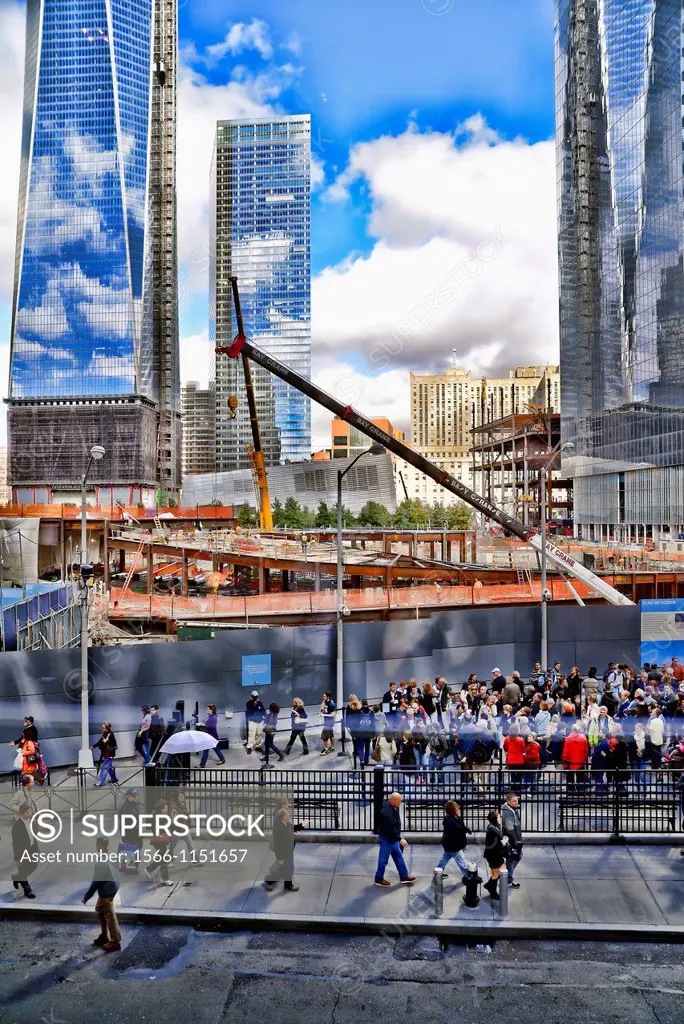 Overlooking the Construction Site at the World Trade Center, New York City, in the foreground, visitors lined up and walking into the WTC September 11...