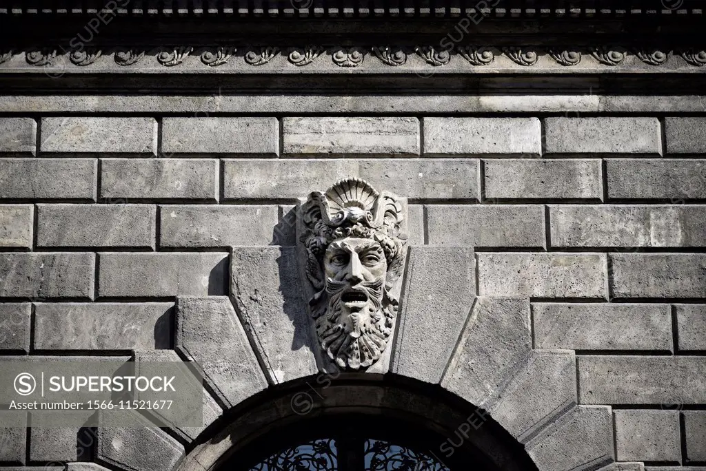 Stone sculpture of a head on a wall of the Hungarian State Opera House. Hungary, Budapest, Pest.