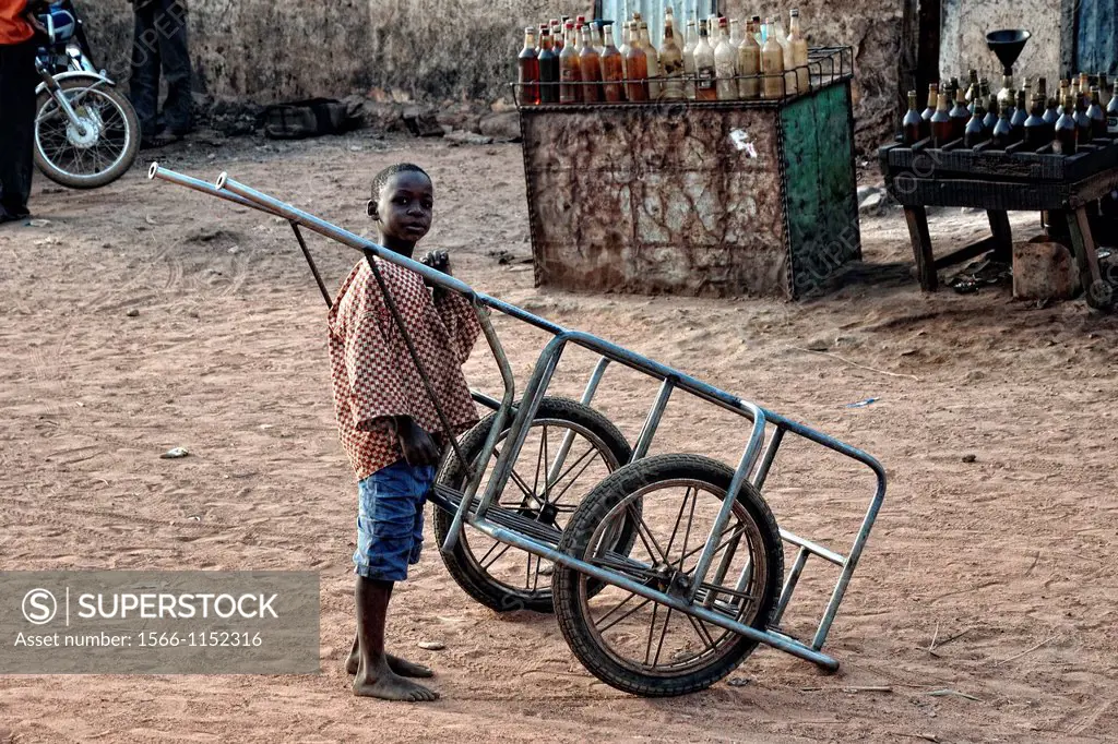 Boy and wheelbarrow  Benin