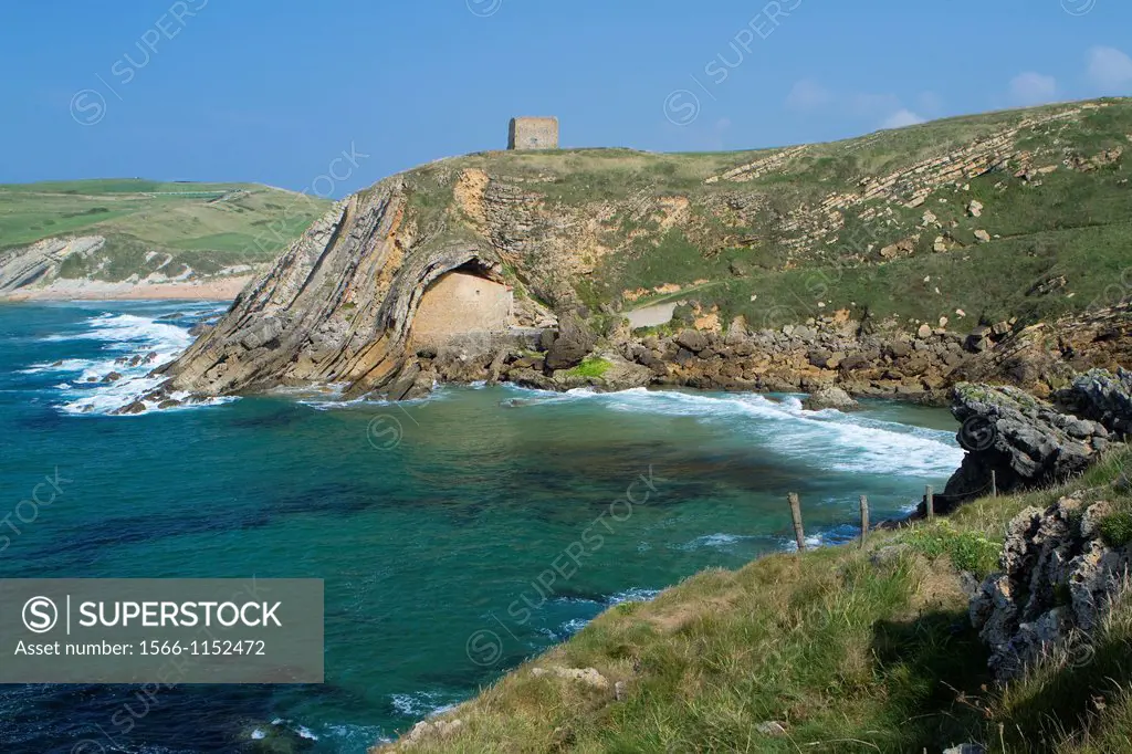 The small Santa Justa Chapel, embedded into the cliff  Santa Justa beach, Ubiarco village  Santillana del Mar  Cantabria  Spain