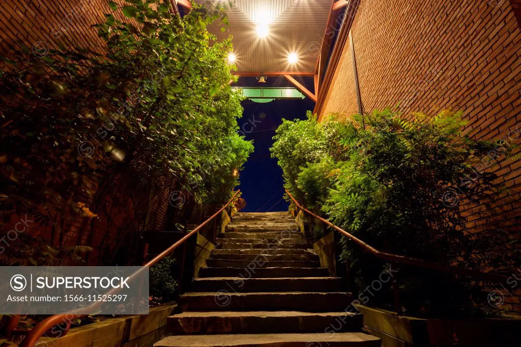 The Wallis Mill Laneway Stairs. Looking up towards Maple Street in downtown Port Carling at dusk. Ontario, Canada.