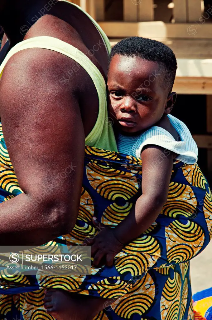 Baby carried on back by his mother  Lomé, Togo