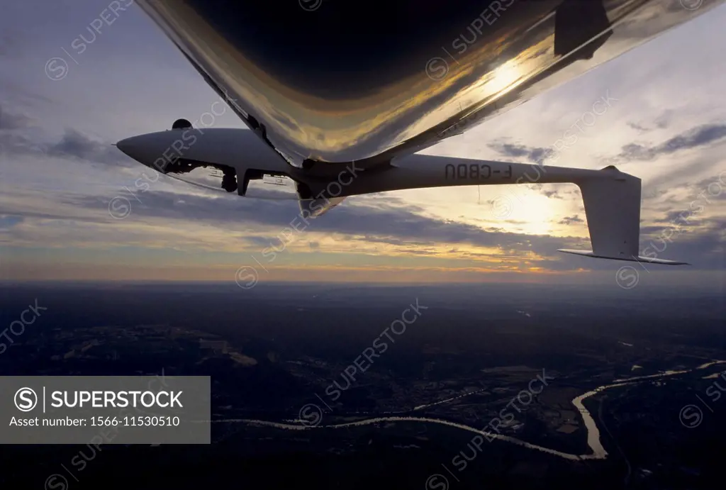 Glider plane in aerobatic flight over Nancy, Lorraine region, France.