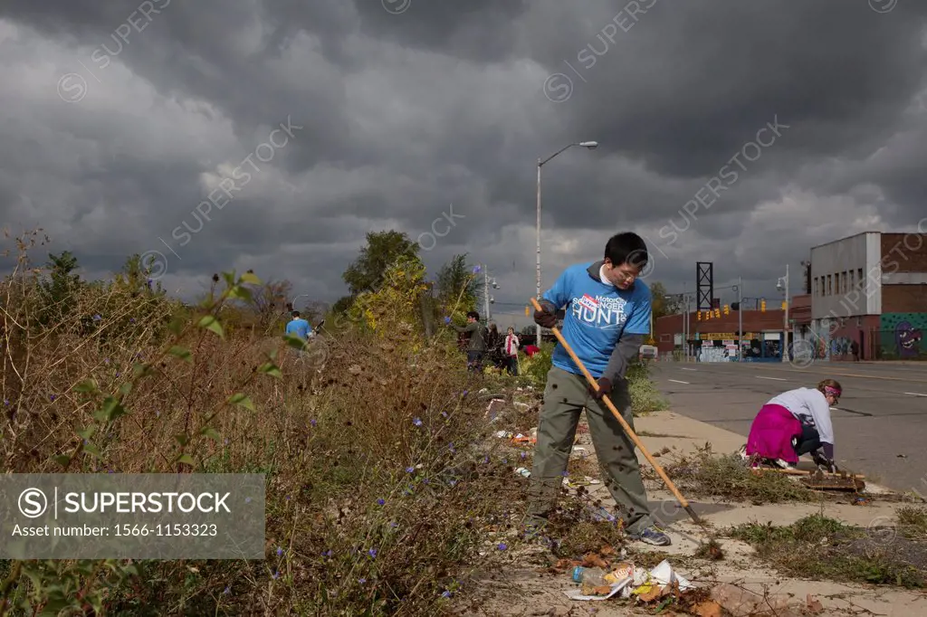 Detroit, Michigan - Volunteers, mostly students from Wayne State University, clean trash and debris from a section of Grand River Avenue  The effort w...