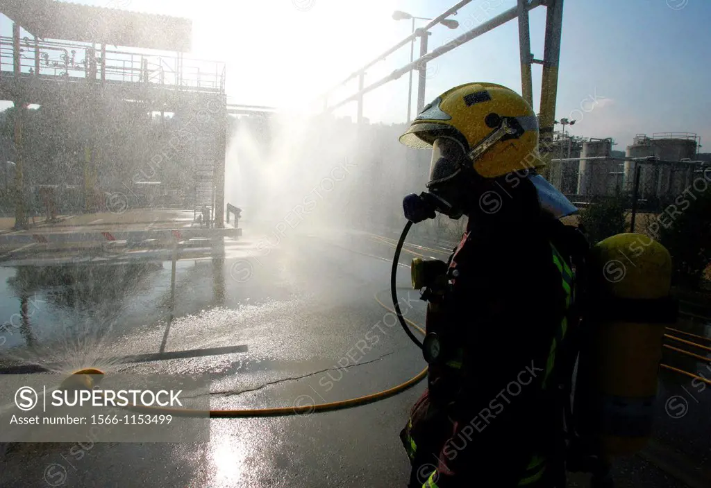 Firefighters fighting againts chemical leak. Cerdanyola del Vallès, Barcelona province, Spain