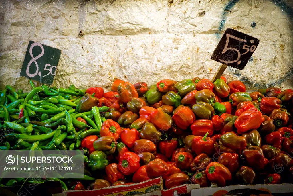 Closeup of red peppers and green chilli peppers with the price 8, 50 - 5, 50 in a market in Jerusalem, Israel, Middle East