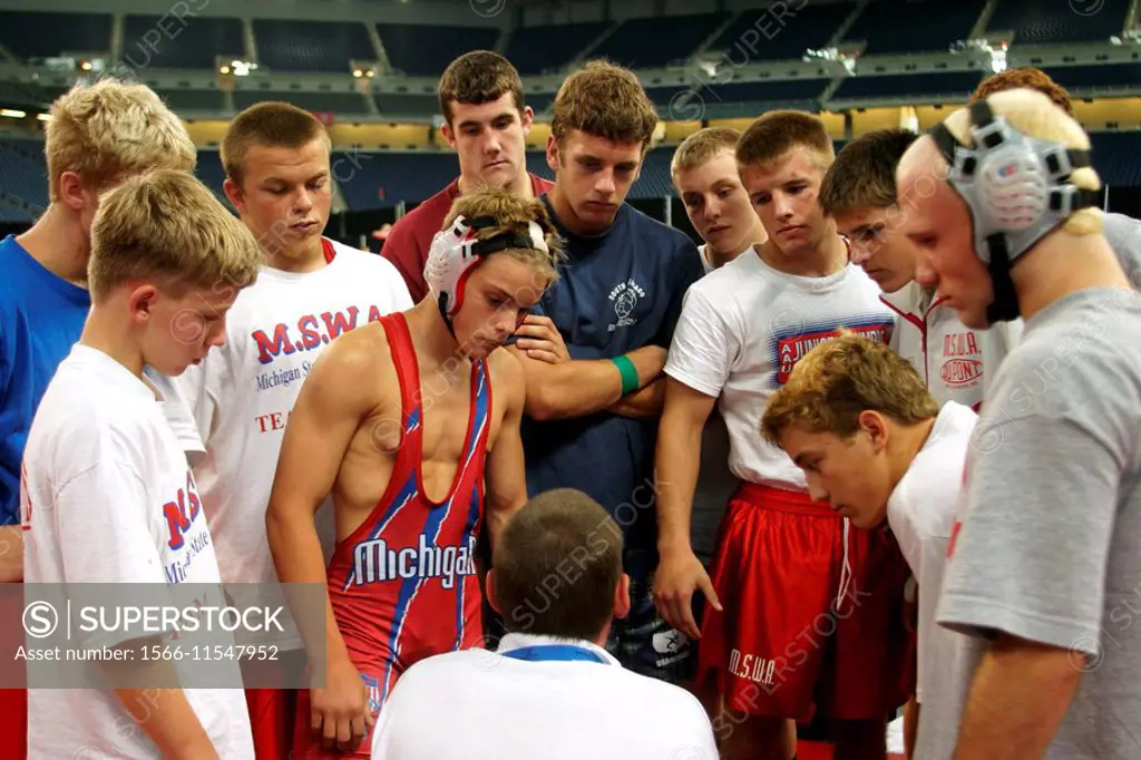 Detroit, Michigan - The AAU Junior Olympics  A coach gathers his team for a pep talk before wrestling competition