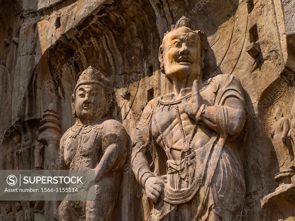Statue of Vaisravana and warrior  North wall of Fengxiansi Cave  The grottoes were started around the year 493 when Emperor Xiaowen of the Northern We...