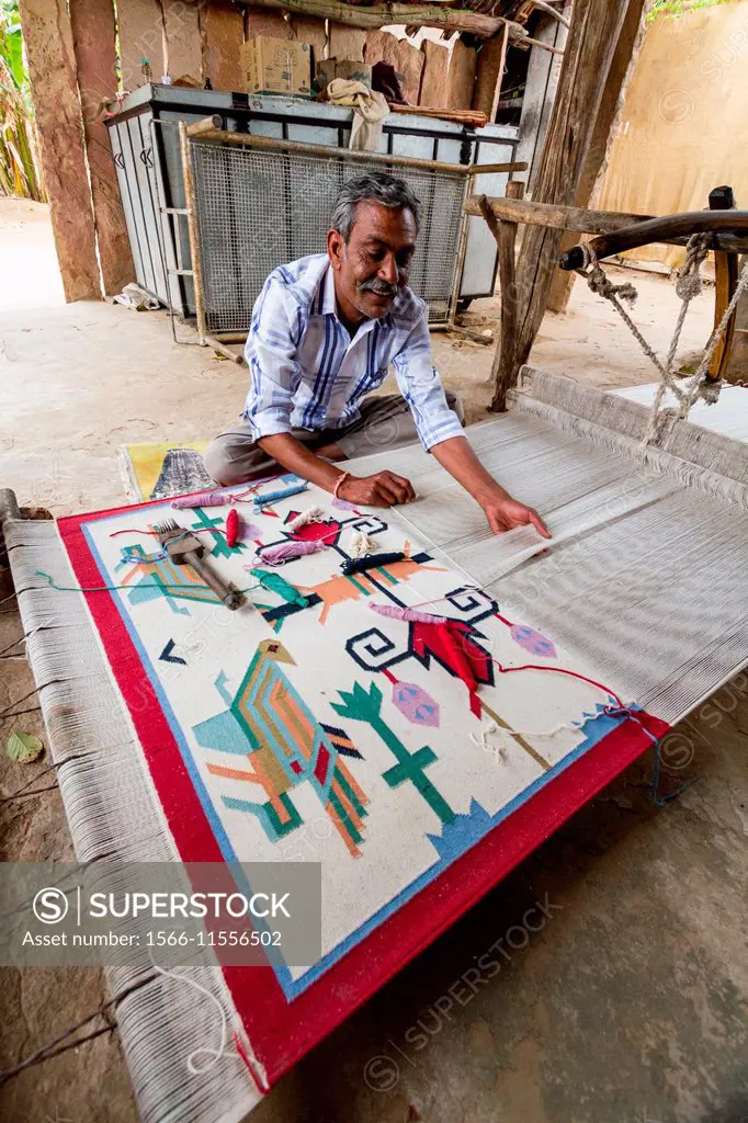 Craftsman with his machine to make carpets, Rajasthan, India