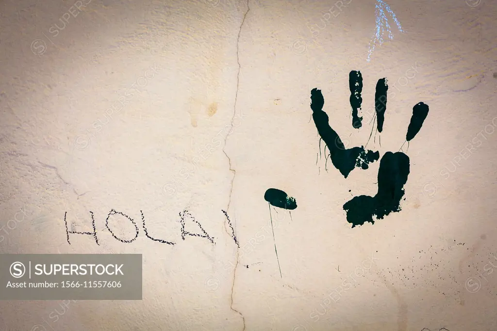 Wall with palm of hand painted and the word hello written in Valencia, Spain, Europe.
