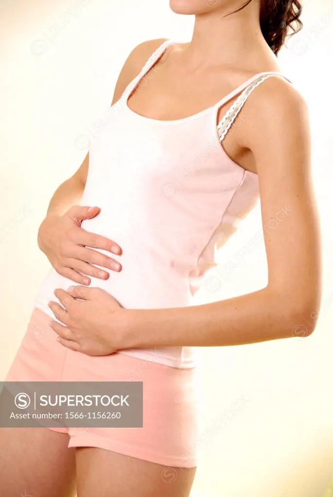 Woman holding her painful abdomen