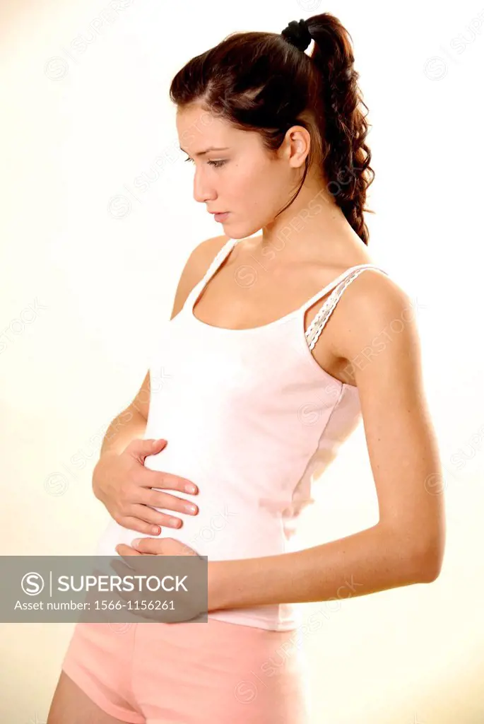 Woman holding her painful abdomen