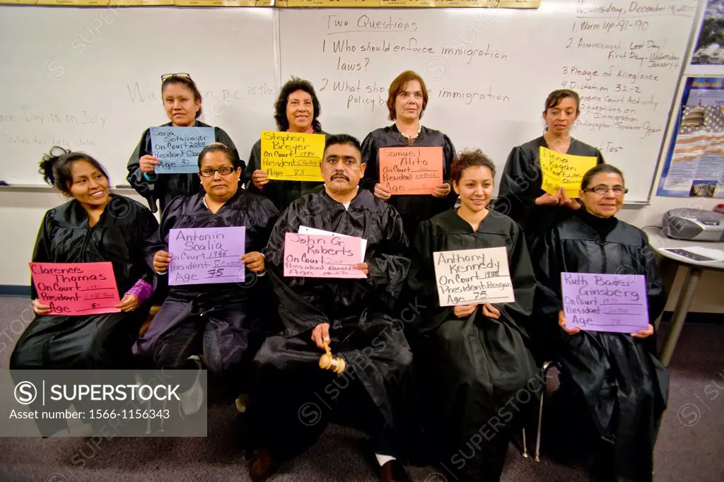 Mostly-Hispanic students at an adult-education U S citizenship class in San Juan Capistrano, CA, understand the judicial branch of the government by p...