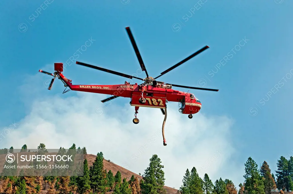Helicopter, Firefighting on the Springs Fire with the Ericson Sikorsky S-64 Sky Crane helicopter with snorkel at the Payette River in the North Fork M...