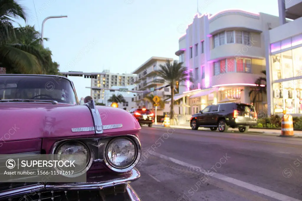 A vintage car at a touristic street in Downtown Miami, Florida.