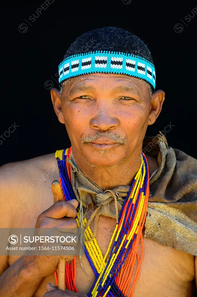 Portrait of Naro San Bushman, wearing traditional clothing and headband, Kalahari, Ghanzi region Botswana, Africa.