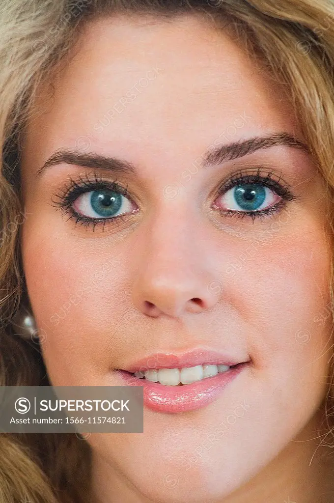 Close up portrait of pretty young woman looking at the camera.