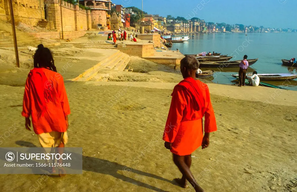 two sadhus in red sari´s at the ghats of varanasi, india