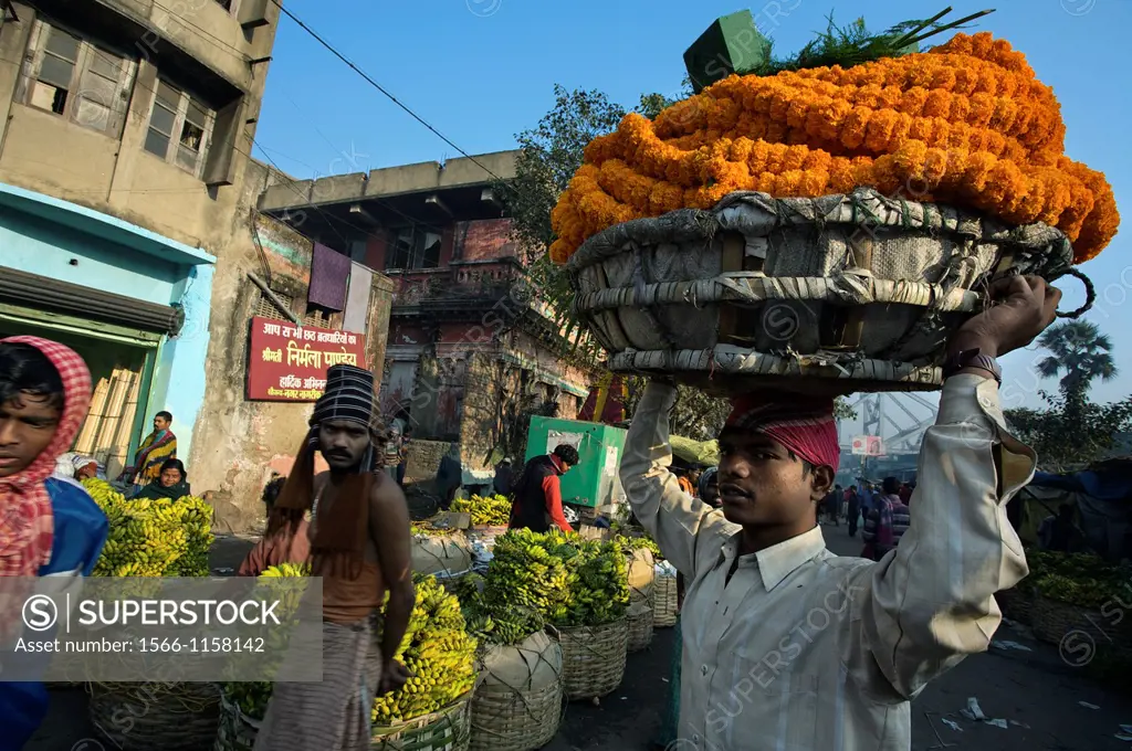 Flowers market under Howrah bridge, Kolkata, India, Ganges River.