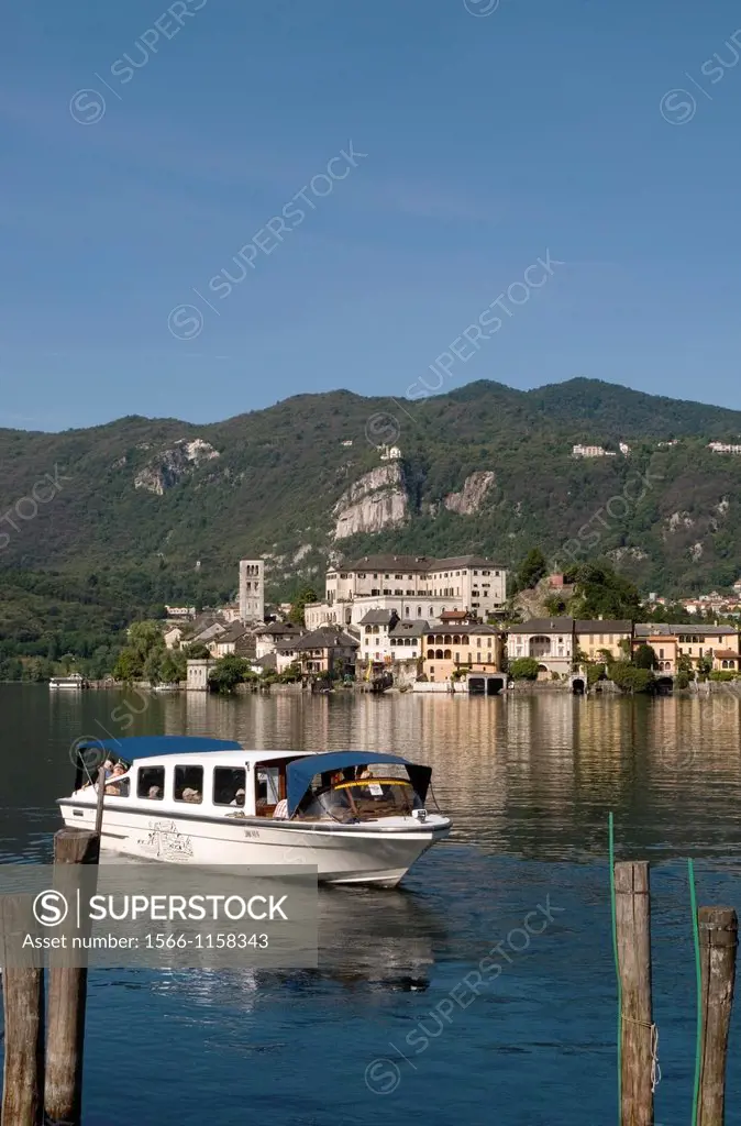 motorboat and San Giulio Island, lake Orta, Piedmont, Italy